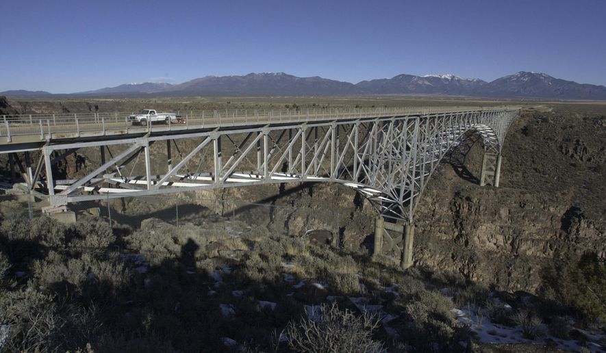 FILE - This Dec. 9, 2006 file photo, shows the Rio Grande Gorge Bridge near Taos N.M. New Mexico lawmakers are pushing a measure aimed at curbing suicides at one of the state's most famous bridges. (AP Photo/Mike Stewart, File)