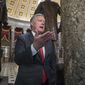 Rep. Mark Meadows, R-N.C., chairman of the conservative Freedom Caucus, speaks during a television news interview just before passage of the Republican tax reform bill in the House of Representatives, on Capitol Hill, in Washington, Tuesday, Dec. 19, 2017. (AP Photo/J. Scott Applewhite)