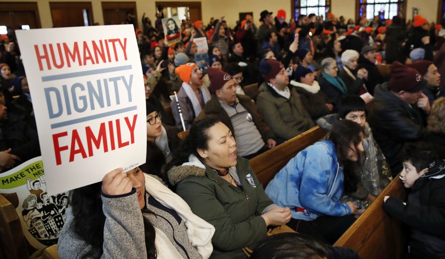People rally in support of the Deferred Action for Childhood Arrivals (DACA) program Wednesday, Feb. 7, 2018, at the Lutheran Church of the Reformation, near the Capitol in Washington. (AP Photo/Jacquelyn Martin)