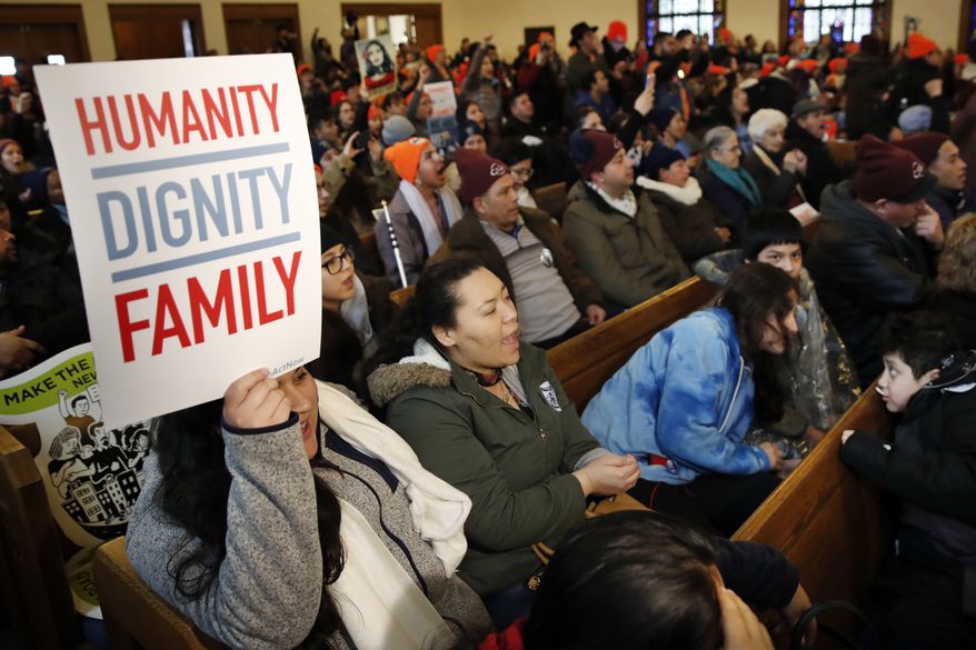 People rally in support of the Deferred Action for Childhood Arrivals (DACA) program Wednesday, Feb. 7, 2018, at the Lutheran Church of the Reformation, near the Capitol in Washington. (AP Photo/Jacquelyn Martin)