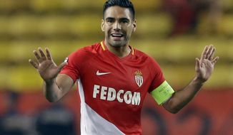 FILE - In this Tuesday, Oct. 17, 2017 file photo, Monaco&#39;s Radamel Falcao gestures during the Champions League Group G first leg soccer match between Monaco and Besiktas at Louis II stadium in Monaco.  Falcao will be out for up to three weeks after sustaining a thigh muscle injury during a 3-2 home win against Lyon on Sunday Feb. 4, 2018 . (AP Photo/Claude Paris, File)