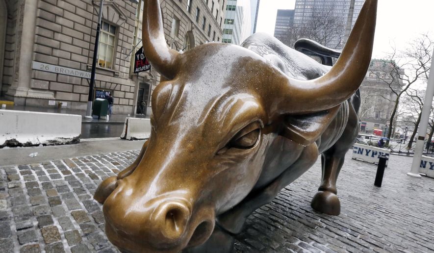 The Charging Bull sculpture by Arturo Di Modica, in New York's Financial District, is shown in this photo, Wednesday, Feb. 7, 2018. The current bull market is set to turn nine years old in about a month. As of Jan. 26, the date of the last market record, the S&P 500 had more than quadrupled over that time. The market had made big gains over the last year, and many experts felt stocks were overdue for a slump. (AP Photo/Richard Drew)