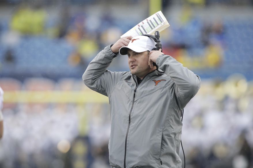 FILE - This Nov. 18, 2017 file photo shows Texas head coach Tom Herman watching his team from the sidelines during the first half of an NCAA college football game against West Virginia in Morgantown, W.Va. Herman and the Texas Longhorns have one of the top signing classes in the nation, not just in the best in the Big 12. After a winning record on the field in Herman’s first season, the Longhorns also made significant strides with the coach’s second recruiting class. Eight more players signed on Wednesday, Feb. 7, 2018 to bolster what was already a strong class with the 19 players added during the early signing period in December. (AP Photo/Raymond Thompson, file)