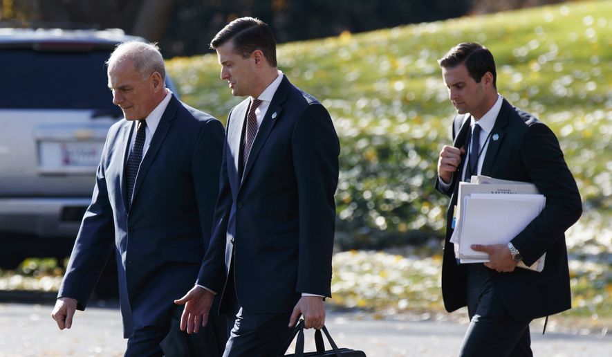 In this Nov. 29, 2017, file photo, White House Chief of Staff John Kelly, left, walks with White House staff secretary Rob Porter, center, and President Donald Trump&#x27;s personal aide John McEntee to board Marine One on the South Lawn of the White House in Washington. (AP Photo/Evan Vucci) ** FILE **