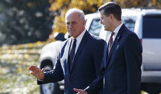 In this Nov. 29, 2017, file photo, White House Chief of Staff John Kelly, left, walks with White House staff secretary Rob Porter to board Marine One on the South Lawn of the White House in Washington. (AP Photo/Evan Vucci)