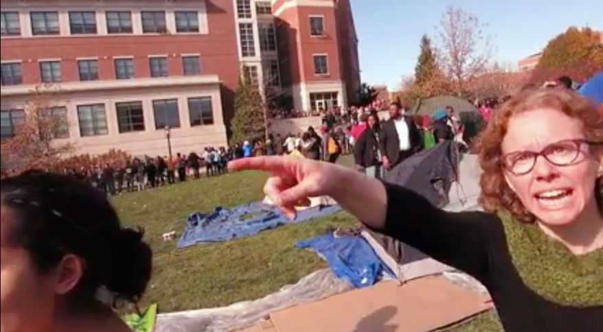 Melissa Click, an assistant professor in the University of Missouri's communications, is seen during a run-in with student journalists during protests on the Columbia campus. Top administrators at the school on Thursday, Feb. 25, 2016, announced they had fired Click. She was suspended after being videotaped calling for "some muscle" to remove a student videographer during the protests. (Mark Schierbecker via AP, File)
