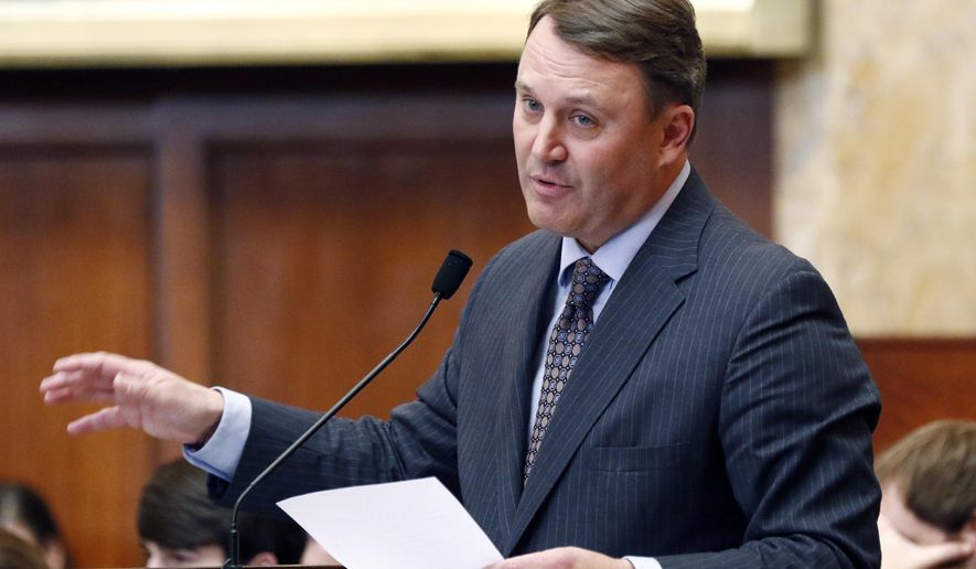 Rep. Jason White, R-West, explains the updating of various provisions relating to a Medicaid bill in the House chamber at the Capitol on Thursday, Feb. 8, 2018, in Jackson, Miss. (AP Photo/Rogelio V. Solis)