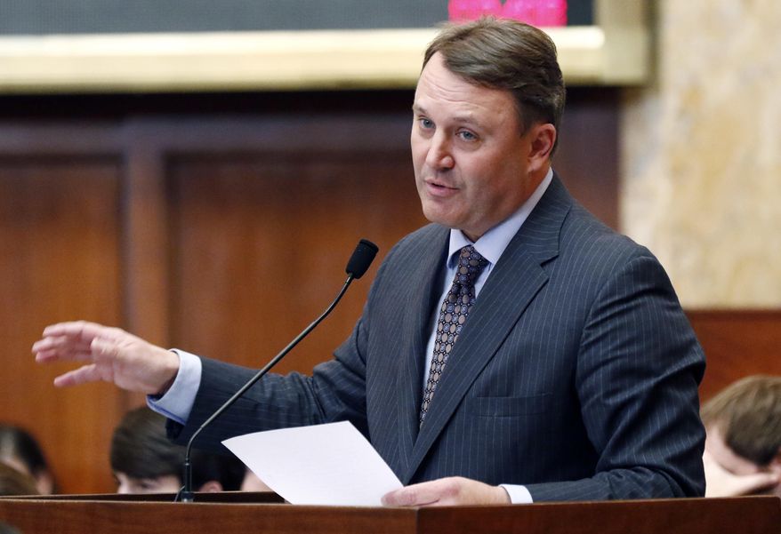 Rep. Jason White, R-West, explains the updating of various provisions relating to a Medicaid bill in the House chamber at the Capitol on Thursday, Feb. 8, 2018, in Jackson, Miss. (AP Photo/Rogelio V. Solis)
