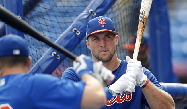 FILE - In this March 13, 2017, file photo, New York Mets&#x27; Tim Tebow (15) takes batting practice before a spring training baseball game against the Miami Marlins in Port St. Lucie, Fla. Tebow will be at the Mets spring training as a non-roster invite. The former NFL quarterback and 2007 Heisman Trophy winner batted .226 with eight homers, 52 RBIs and 126 strikeouts in 126 games last year at two levels of Class-A ball.  (AP Photo/John Bazemore, File) **FILE**