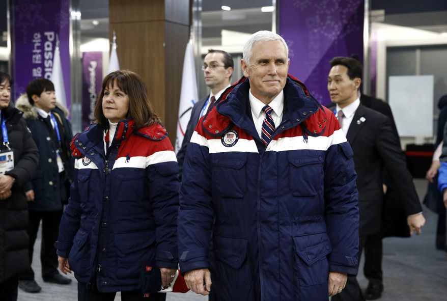 Vice President Mike Pence, right, walks to his seat alongside second lady Karen Pence at the opening ceremony of the 2018 Winter Olympics in Pyeongchang, South Korea, Friday, Feb. 9, 2018. (AP Photo/Patrick Semansky, Pool)