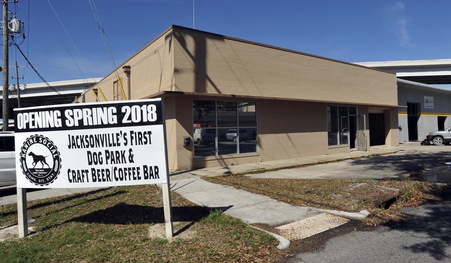 Exterior view of Kanine Social that is under construction Monday, Feb. 5, 2018 on College Street in Jacksonville, Fla. The business is scheduled to open in the spring and will include a doggie daycare facility with a craft beer and coffee bar for their humans. (Will Dickey/The Florida Times-Union via AP)