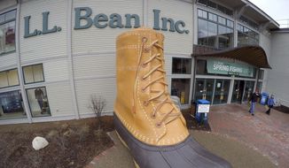 In this March 16, 2016, file photo, shoppers exit the L.L. Bean retail store in Freeport, Maine. (AP Photo/Robert F. Bukaty, File)