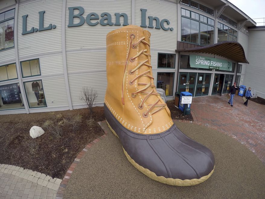 In this March 16, 2016, file photo, shoppers exit the L.L. Bean retail store in Freeport, Maine. (AP Photo/Robert F. Bukaty, File)