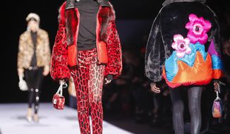 Fashion from Tom Ford is modeled during Fashion Week, Thursday Feb. 8, 2018, in New York. (AP Photo/Bebeto Matthews)