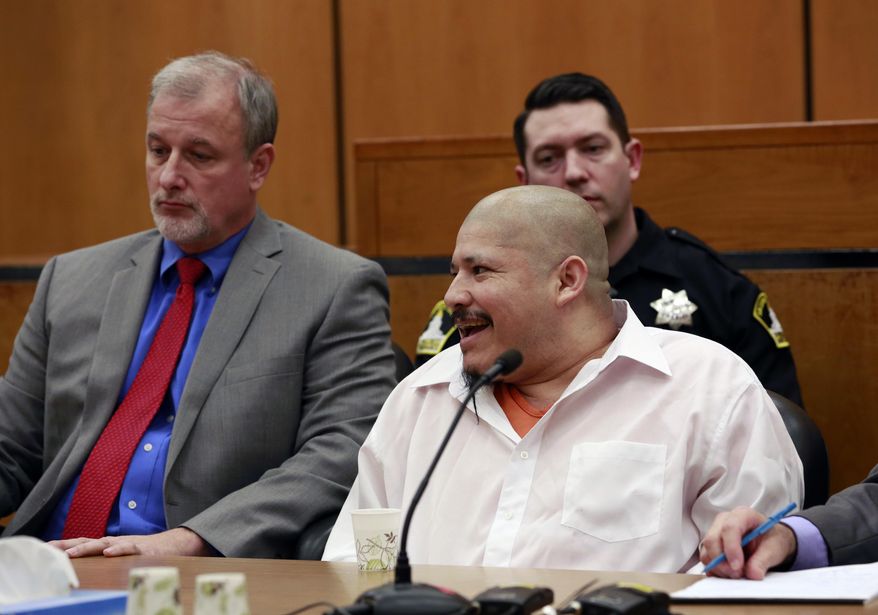 Luis Bracamontes smiles at the courtroom audience as the verdict was read in the killing of two law enforcement officers, in Sacramento Superior Court, Friday, Feb. 9, 2018, in Sacramento, Calif. Bracamontes was found guilty of shooting Sacramento County sheriff’s Deputy Danny Oliver in 2014, then killing Placer County sheriff's Detective Michael Davis Jr. hours later. (AP Photo/Rich Pedroncelli)