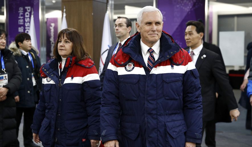 Vice President Mike Pence, right, walks to his seat alongside second lady Karen Pence at the opening ceremony of the 2018 Winter Olympics in Pyeongchang, South Korea, Friday, Feb. 9, 2018. (AP Photo/Patrick Semansky, Pool)
