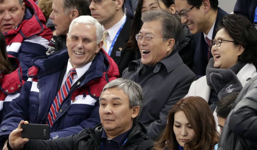 United States&#39; Vice President Mike Pence and South Korean President Moon Jae-in laugh during the ladies&#39; 500 meters short-track speedskating in the Gangneung Ice Arena at the 2018 Winter Olympics in Gangneung, South Korea, Saturday, Feb. 10, 2018. (AP Photo/Julie Jacobson)