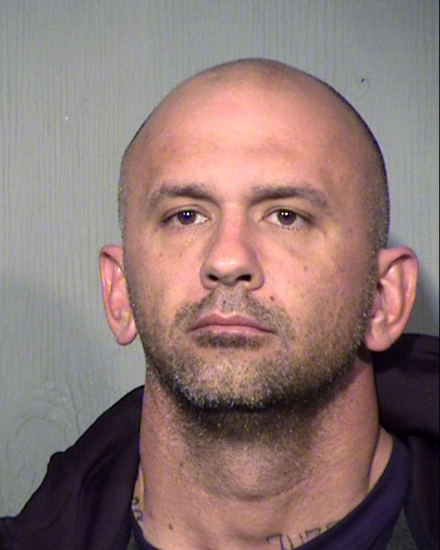In this Friday, Feb. 9, 2018 booking photo released by the Maricopa County Sheriff's Office shows suspect Ryan Donahue at the Maricopa County jail in Phoenix, Ariz. Donahue, a 36-year-old city firefighter, is accused of entering fire stations and stealing from fellow firefighters, sometimes after setting trash fires to keep fire crews away. He remains jailed after being arrested Friday, Feb. 9, 2018, on suspicion of theft, arson, burglary and criminal damage. Police say surveillance and tips led to the arrest of Donahue, an 11-year Fire Department employee who worked as a rover rotating among fire stations. According to police, Donahue committed the thefts while off-duty and while crews were out on calls.(Maricopa County Sheriff's Office via AP)