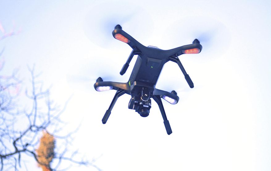A 3DR surveillance drone flies above a prescribed burn area in the Kenai National Wildlife Refuge in Sterling, Alaska, Feb. 1, 2018. (Erin Thompson/Peninsula Clarion via AP) ** FILE **