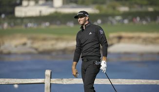 Dustin Johnson follows his shot from the seventh tee of the Pebble Beach Golf Links during the third round of the AT&amp;amp;T Pebble Beach National Pro-Am golf tournament Saturday, Feb. 10, 2018, in Pebble Beach, Calif. (AP Photo/Eric Risberg)