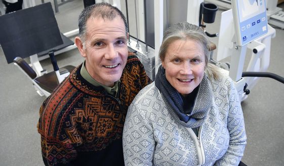 Seen in a Thursday, Feb. 1, 2018 photo, orthopedic surgeon Dr. Joel Shobe and his wife Susan will both be working at the Winter Olympics in South Korea.  Joel will be on the medical staff of short track speed skating and Susan will be a speed skating official. (Jason Wachter/St. Cloud Times via AP)