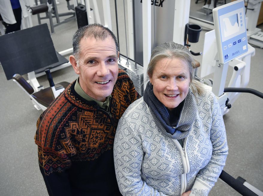Seen in a Thursday, Feb. 1, 2018 photo, orthopedic surgeon Dr. Joel Shobe and his wife Susan will both be working at the Winter Olympics in South Korea.  Joel will be on the medical staff of short track speed skating and Susan will be a speed skating official. (Jason Wachter/St. Cloud Times via AP)
