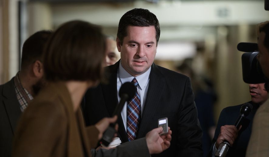In this March 28, 2017, file photo, House Intelligence Committee Chairman Rep. Devin Nunes, R-Calif., is pursued by reporters on Capitol Hill in Washington. (AP Photo/J. Scott Applewhite, File)