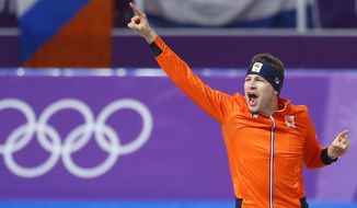 Gold medallist Sven Kramer of The Netherlands celebrates setting a new Olympic record during the men&#x27;s 5,000 meters race at the Gangneung Oval at the 2018 Winter Olympics in Gangneung, South Korea, Sunday, Feb. 11, 2018. (AP Photo/Petr David Josek)