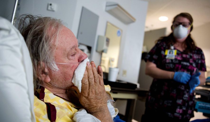 Henry Beverly battles the flu while tended to by nurse Kathleen Burks in a Thomaston, Georgia, hospital. This flu season is the worst since health officials began record keeping in 2004, surpassing the previous worst outbreak of 2014/15. (ASSOCIATED PRESS)