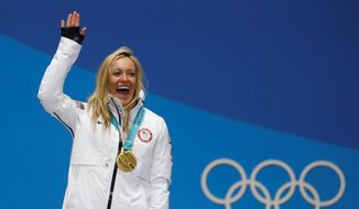 American Jamie Anderson cemented herself as an all-time great by winning and defending her gold medal on Monday in the women&#39;s slopestyle at the Winter Olympics in Pyeongchang, South Korea. Anderson won despite overcoming shifting, bitter winds and iced-over jumps at the snow park. Her score of 83 resulted in a blowout of nearly seven points over silver medalist Laurie Blouin of Canada. (ASSOCIATED PRESS PHOTOGRAPHS)