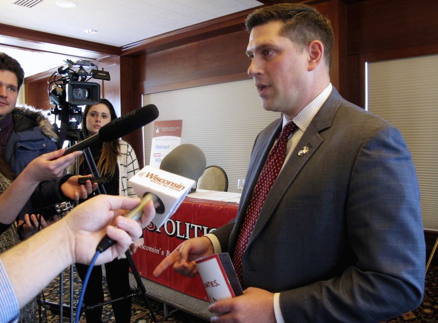 FILE - In this Jan. 30, 2018, file photo, Wisconsin Republican Senate candidate Kevin Nicholson speaks with reporters in Madison, Wis. Nicholson faces Republican state Sen. Leah Vukmir in the Republican primary. The winner will face Democratic Sen. Tammy Baldwin in the November election. (AP Photo/Scott Bauer, File)