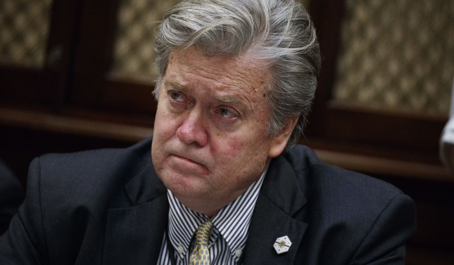 White House chief strategist Steve Bannon listens as President Donald Trump speaks during a meeting with county sheriffs in the Roosevelt Room of the White House in Washington, Tuesday, Feb. 7, 2017. (AP Photo/Evan Vucci)