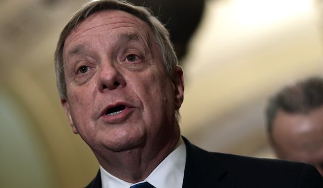 Sen. Dick Durbin, D-Ill., speaks to reporters on Capitol Hill in Washington, Tuesday, Feb. 13, 2018, following the weekly Democratic policy luncheon. (AP Photo/Susan Walsh) ** FILE **