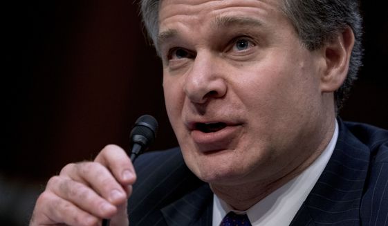 FBI Director Christopher Wray speaks during a Senate Select Committee on Intelligence hearing on worldwide threats, Tuesday, Feb. 13, 2018, in Washington. (AP Photo/Andrew Harnik)