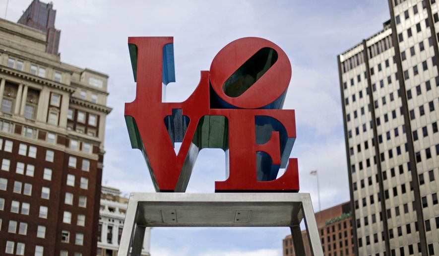 FILE - This Nov. 10, 2010, file photo, shows artist Robert Indiana&#x27;s LOVE sculpture in John F. Kennedy Plaza, also known as Love Park, in Philadelphia. The sculpture, temporarily relocated in 2016 before renovations to the plaza, is set to return to its traditional location Tuesday, Feb. 13, 2018, ahead of Valentine&#x27;s Day. The tourist attraction has been repainted to its original colors and will be installed on a new rectangular pedestal, in keeping with how Indiana&#x27;s other works are displayed. (AP Photo/Matt Rourke, File)