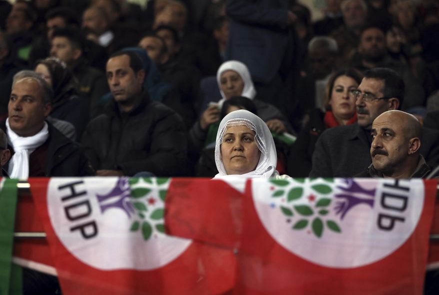 Party members listen during the congress of pro-Kurdish Peoples' Democratic Party, or HDP, in Ankara, Turkey, Sunday, Feb. 11, 2018. HDP is voting in Ankara as co-chairmen Selahattin Demirtas and Figen Yuksekdag step down. Demirtas and Yuksekdag has been behind bars pending trial since November 2016 for alleged terror charges, accused of links to outlawed Kurdish militants.(AP Photo/Burhan Ozbilici)