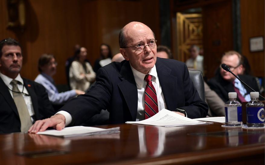 Internal Revenue Service Acting Commissioner David Kautter gathers his papers as he prepares to testify before the Senate Finance Committee on Capitol Hill in Washington, Wednesday, Feb. 14, 2018, on President Donald Trump&#39;s fiscal year 2019 budget proposal. (AP Photo/Susan Walsh) ** FILE **