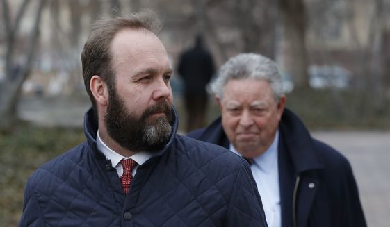 Rick Gates, left, with his lawyer Tom Green, depart federal district court in Washington on Wednesday, Feb. 14, 2018. (Associated Press) **FILE**