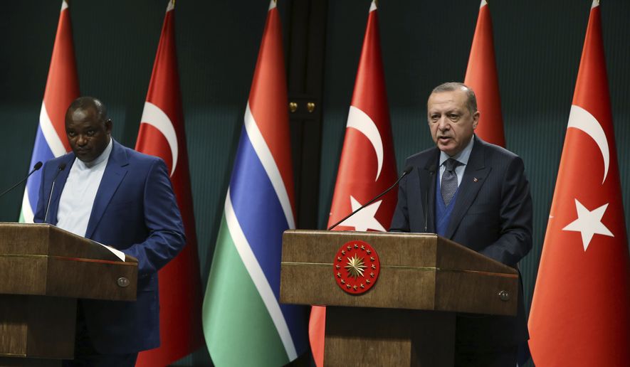 Turkey&#39;s President Recep Tayyip Erdogan, right, and Gambia&#39;s President Adama Barrow speak during a joint press conference at the presidential palace in Ankara, Turkey, Wednesday, Feb. 14, 2018. Barrow is in Turkey for a two-day state visit.(Kayhan Ozer/Pool Photo via AP)