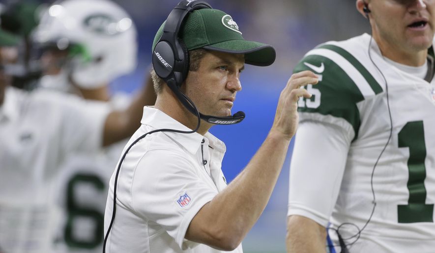 FILE - In this Saturday, Aug. 19, 2017 file photo, New York Jets quarterbacks coach Jeremy Bates signals during the second half of an NFL preseason football game against the Detroit Lions in Detroit. The New York Jets promoted Bates from quarterbacks coach to offensive coordinator Wednesday, Feb. 14, 2018 replacing the fired John Morton.(AP Photo/Duane Burleson, File)