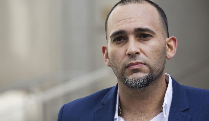 Iraq war veteran Jose Belen, who takes marijuana to treat post-traumatic stress disorder, poses in front of federal court, Tuesday, Feb. 13, 2018, in New York. Belen is one of five plaintiffs in a lawsuit challenging federal marijuana laws. He is set to appear in a New York courtroom on Wednesday for arguments in a lawsuit that claims classifying marijuana as a dangerous drug is irrational and unconstitutional. (AP Photo/Mark Lennihan)