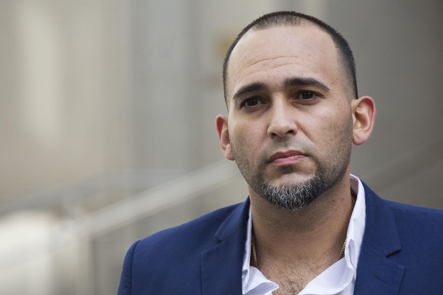 Iraq war veteran Jose Belen, who takes marijuana to treat post-traumatic stress disorder, poses in front of federal court, Tuesday, Feb. 13, 2018, in New York. Belen is one of five plaintiffs in a lawsuit challenging federal marijuana laws. He is set to appear in a New York courtroom on Wednesday for arguments in a lawsuit that claims classifying marijuana as a dangerous drug is irrational and unconstitutional. (AP Photo/Mark Lennihan)