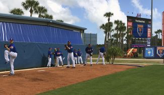 New York Mets pitchers, from left, Zack Wheeler, Noah Syndergaard, Seth Lugo and Steven Matz throw at baseball spring training in Port St. lucie, Fla., Wednesday, Feb. 14, 2018. With a quintet of powerful young arms in place, the future looked so bright for the New York Mets a few years back. But a string of injuries has prevented the team from ever filling out its dream rotation of Jacob deGrom, Noah Syndergaard, Matt Harvey, Steven Matz and Zack Wheeler. This season might represent the last chance. (AP Photo/Mike Fitzpatrick)