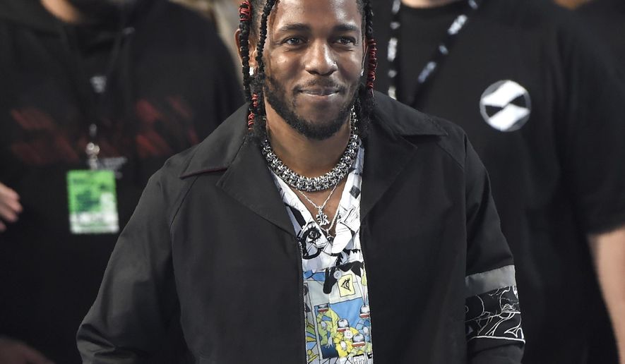FILE - In this Aug. 27, 2017 file photo, Kendrick Lamar arrives at the MTV Video Music Awards in Inglewood, Calif. Lamar curated the release, "Black Panther The Album Music from and Inspired By," performed by various artists. (Photo by Chris Pizzello/Invision/AP, File)