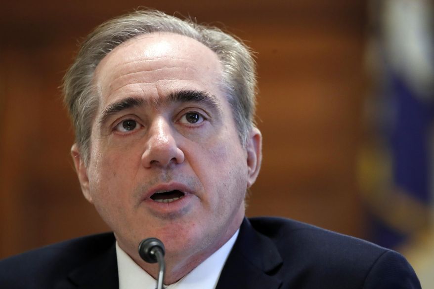 File - In this Feb. 6, 2018 file photo, Veterans Affairs Secretary David Shulkin speaks during a House Committee on Veterans' Affairs hearing on veteran caregiver support on Capitol Hill in Washington. An internal watchdog’s investigation has found that Veterans Affairs Secretary David Shulkin improperly accepted Wimbledon tennis tickets and likely wrongly used taxpayer money to cover his wife's airfare for an 11-day European trip. (AP Photo/Jacquelyn Martin)