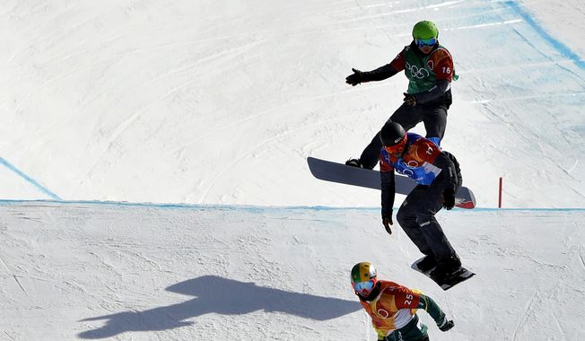 From bottom to top; Pierre Vaultier, of France, Jarryd Hughes, of Australia, Markus Schairer, of Austria, and Hanno Douschan, of Austria, runs the course during the men&#x27;s snowboard cross elimination round at Phoenix Snow Park at the 2018 Winter Olympics in Pyeongchang, South Korea, Thursday, Feb. 15, 2018. (AP Photo/Gregory Bull)