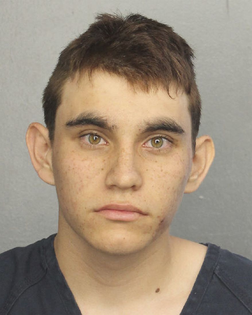 This photo provided by the Broward County Jail shows Nikolas Cruz. Authorities say Cruz, a former student opened fire at Marjory Stoneman Douglas High School in Parkland, Fla., Wednesday,  Feb. 14, 2018, killing more than a dozen people and injuring several. (Broward County Jail via AP)