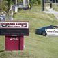 Law enforcement officers blocked off the entrance to Marjory Stoneman Douglas High School in Parkland, Florida, on Thursday. Nikolas Cruz was charged with 17 counts of premeditated murder. (Associated Press)