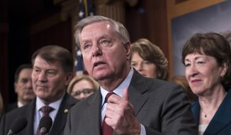 Sen. Lindsey Graham, R-S.C., flanked by, Sen. Mike Rounds, R-S.D., left, and Sen. Susan Collins, R-Maine, discuss the bipartisan immigration deal they reached during a news conference at the Capitol in Washington, Thursday, Feb. 15, 2018. (AP Photo/J. Scott Applewhite) ** FILE **