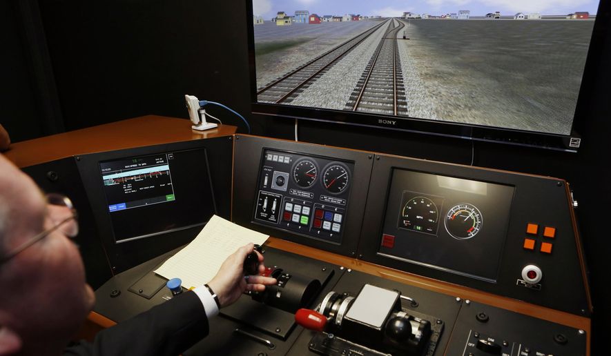 Positive train control offers the prospect of more one-person crews and even self-driving trains, but railroad unions object, claiming that reduced crews put workers and the public at risk. (Associated Press/File)